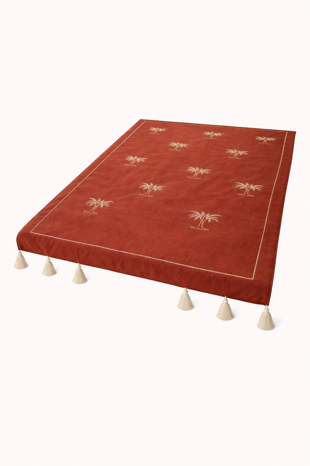 Cozy terracotta throw with palm details