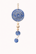 Blue ceramic medallion with tassel